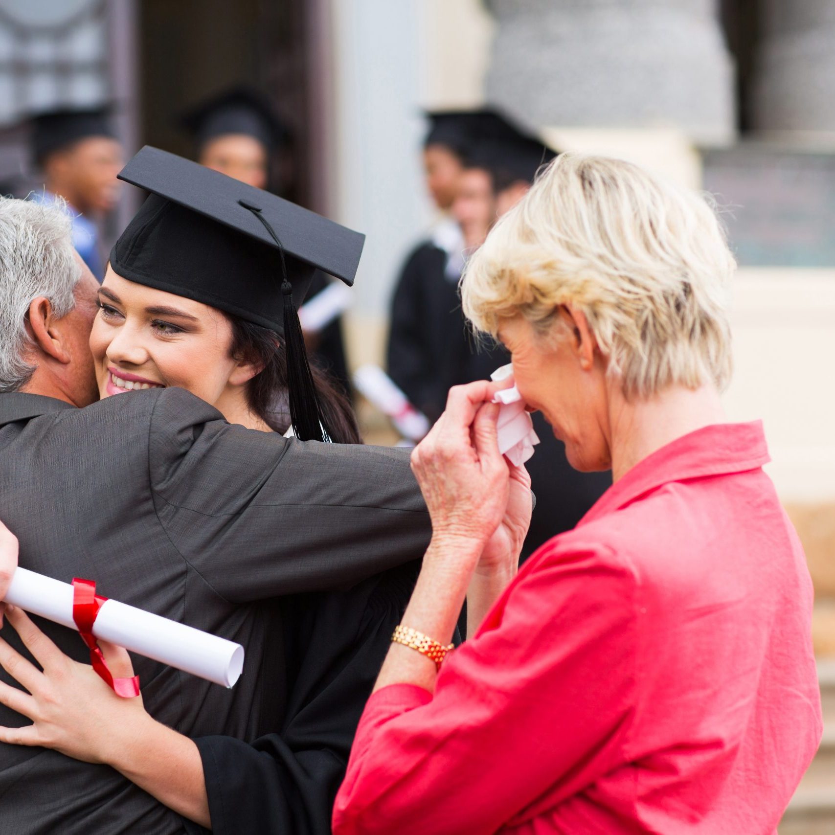 Beautiful,Young,Female,Graduate,Hugging,Her,Father,At,Graduation